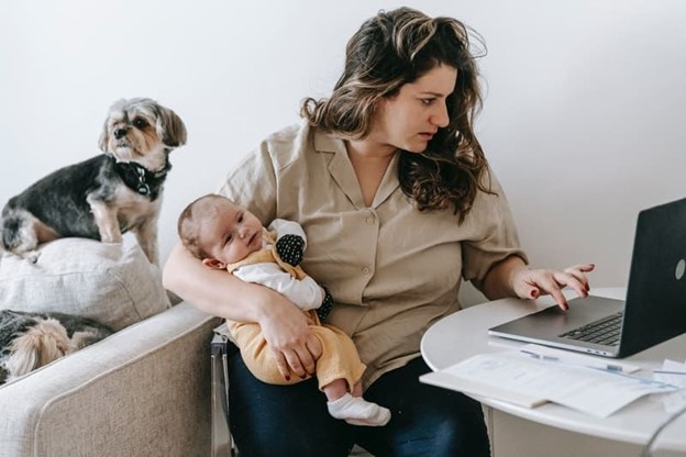 Woman researching how to boost confidence after having a baby (models)