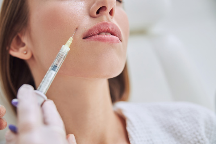 Injectable facial treatment targeting the lower cheek and jawline to refine facial contours.
